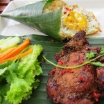 Impeccably presented Thit Heo - grilled pork with a side of rice and egg.