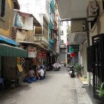 The quiet alley outside.