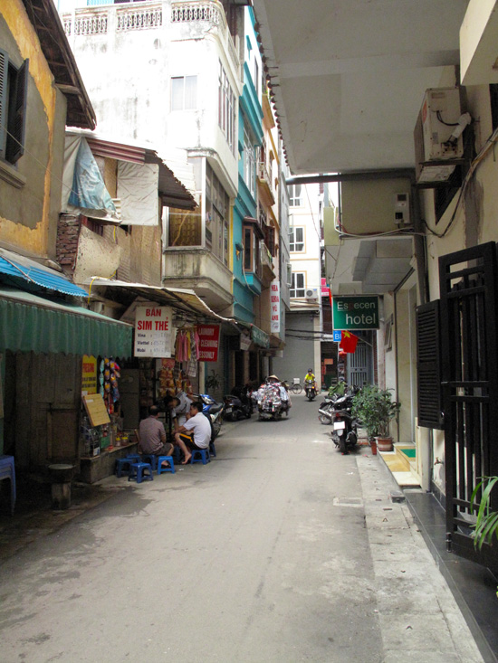 The quiet alley outside.