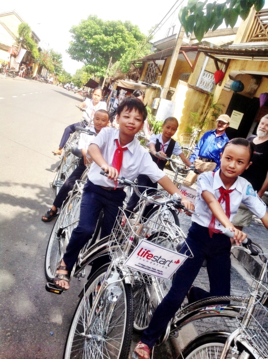 Kids receiving their new Lifestart school bikes.