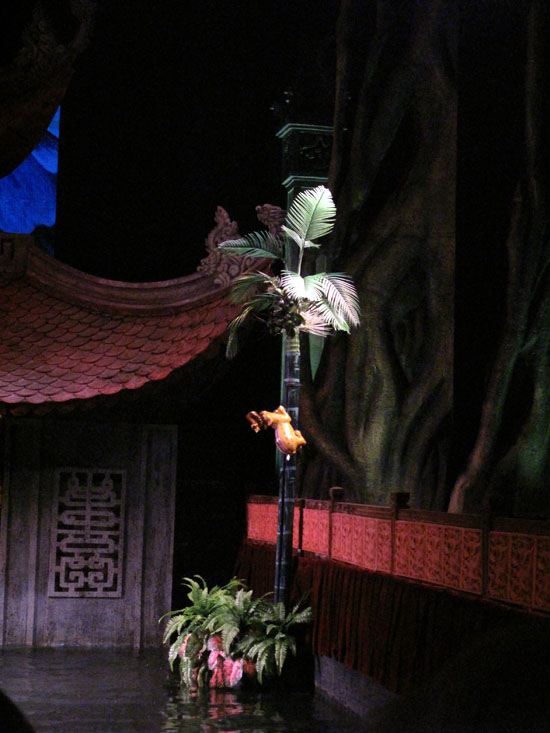 The fox - which looks like a cat - grabs a duck and runs up a tree.