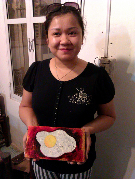 Tuan's assistant displays the (almost) finsihed product. Just a sand and another coat of varnish to go.